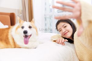 lovepik-woman-taking-selfie-with-pet-dog-picture_502361569